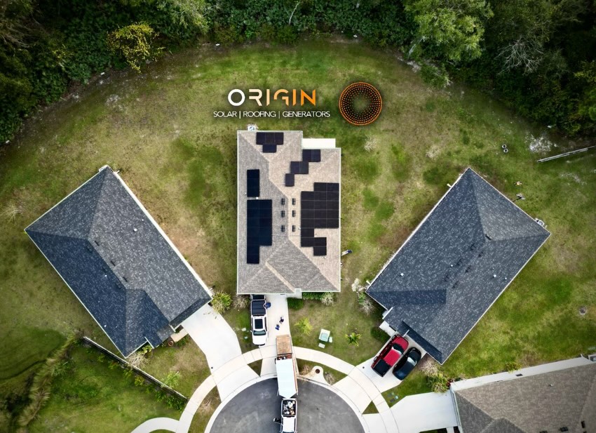 Overhead view of solar panels on a shingle-roof home at the end of a cul-de-sac